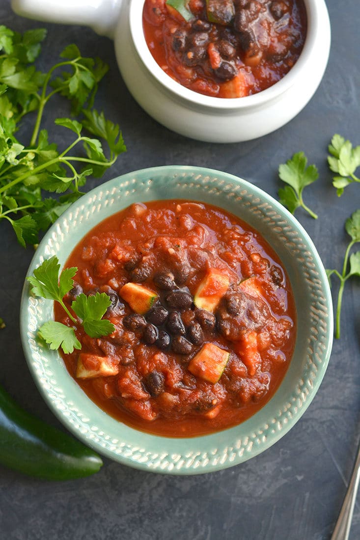 Slow Cooker Black Bean Chili! This vegan chili is full of zucchini & beans with a kick of spice! Hearty, filling, perfect for warming up on a cold day! Gluten Free + Low Calorie + Vegan