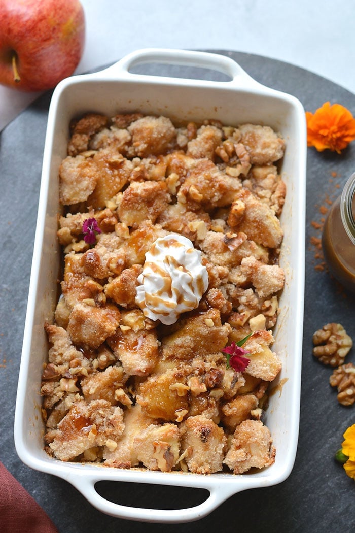 Gluten Free Apple Crisp made with almond flour, cinnamon and lower in sugar. An easy apple crisp that's better balanced in nutrition and dairy free. A healthy dessert recipe that everyone goes crazy for! Gluten Free + Low Calorie + Paleo
