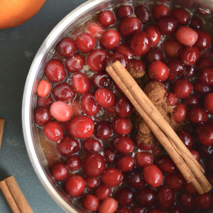 Homemade Sugar Free Cranberry Sauce naturally sweetened with oranges and spices. Easy, warm, filling! Wonderful as a side or gift. Gluten Free + Paleo + Vegan + Low Calorie