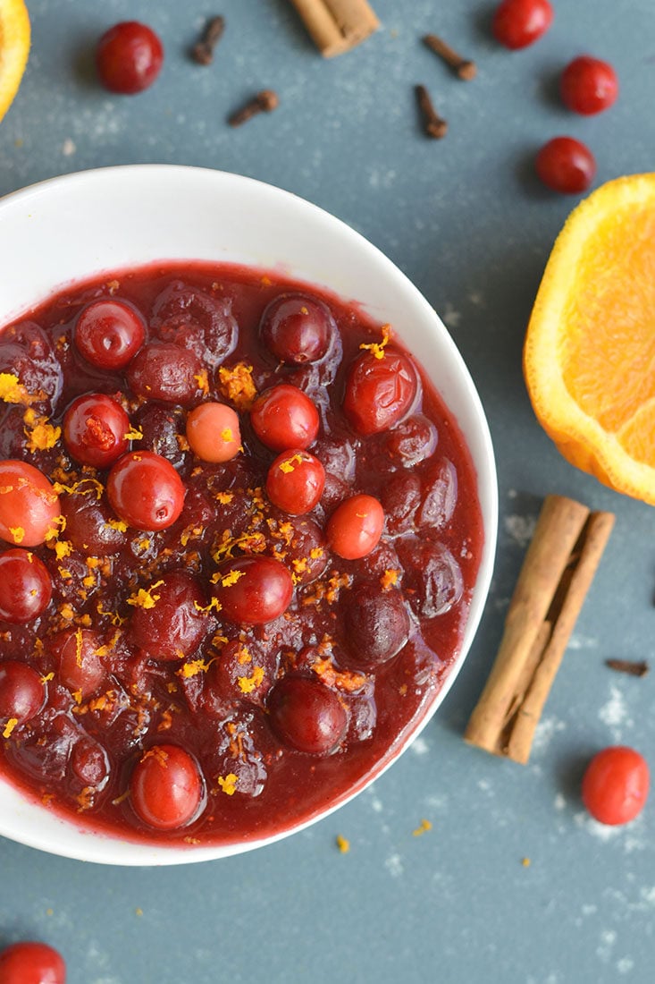 Homemade Sugar Free Cranberry Sauce naturally sweetened with oranges and spices. Easy, warm, filling! Wonderful as a side or gift. Gluten Free + Paleo + Vegan + Low Calorie