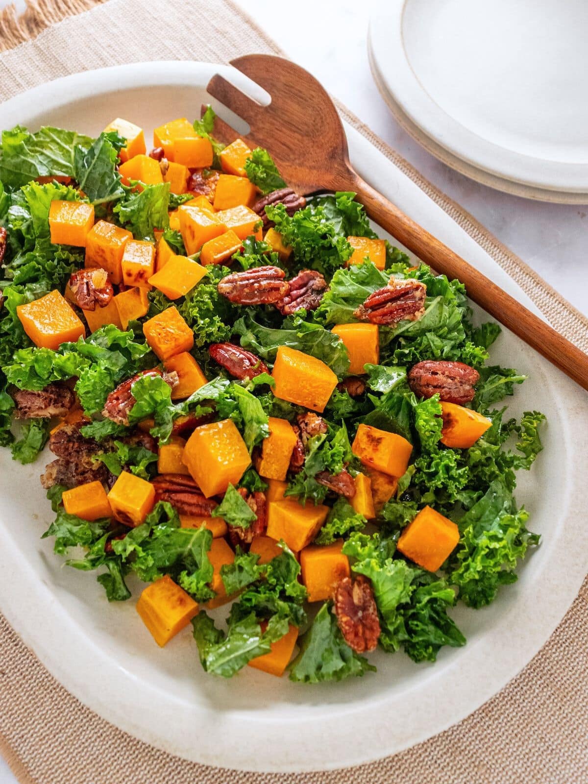 Kale butternut squash salad on a plattter.