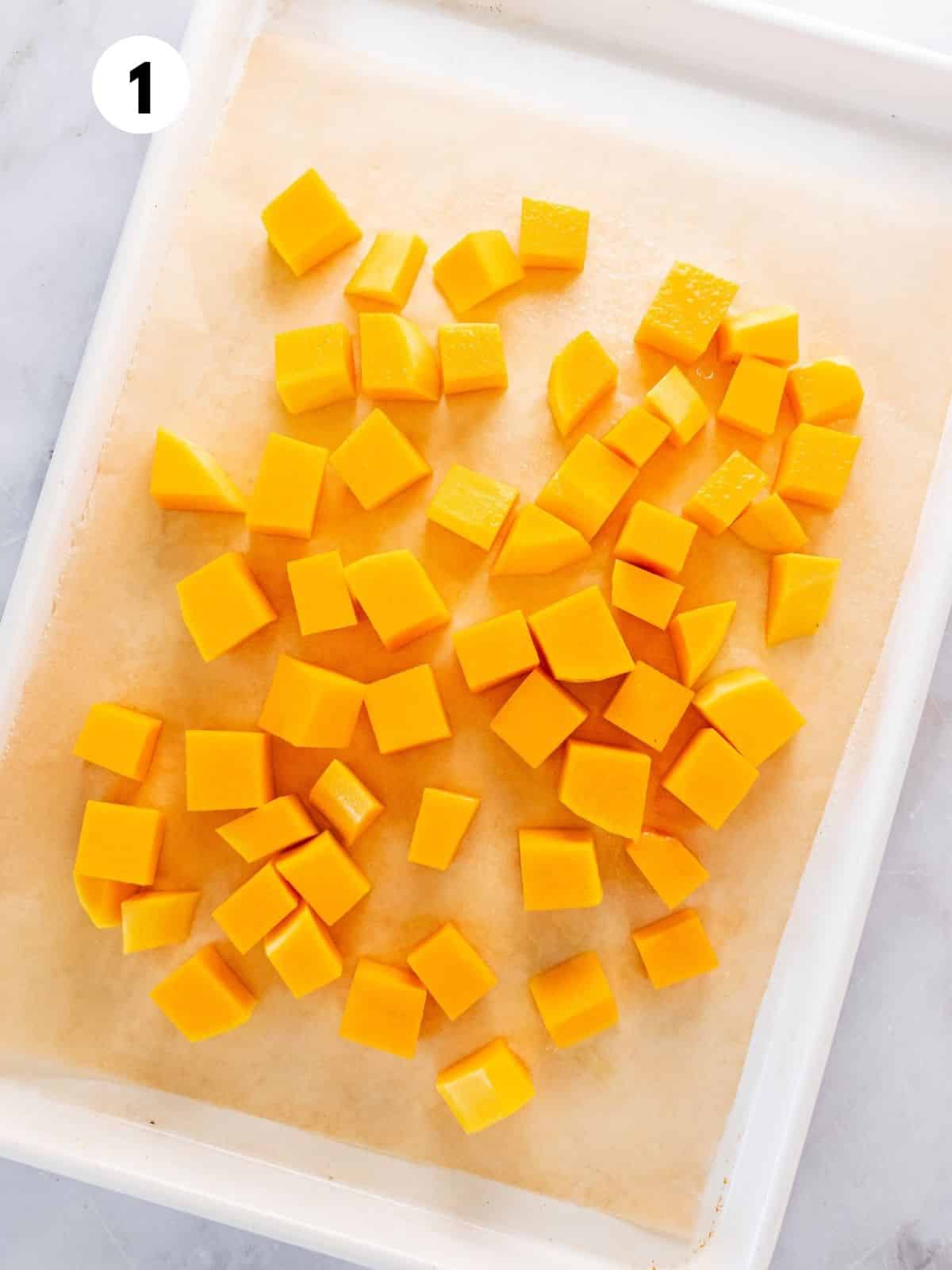 Cut butternut squash in a dish.
