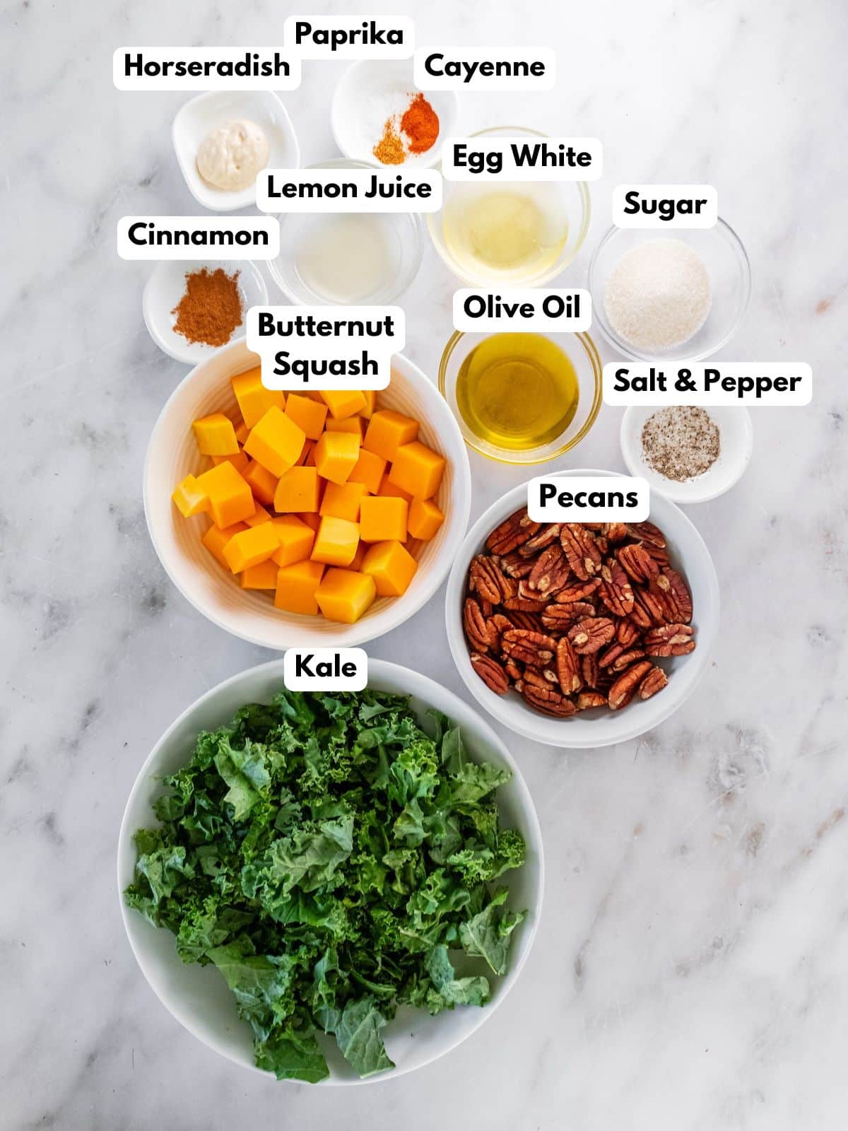 Ingredients for making kale butternut squash salad in bowls.