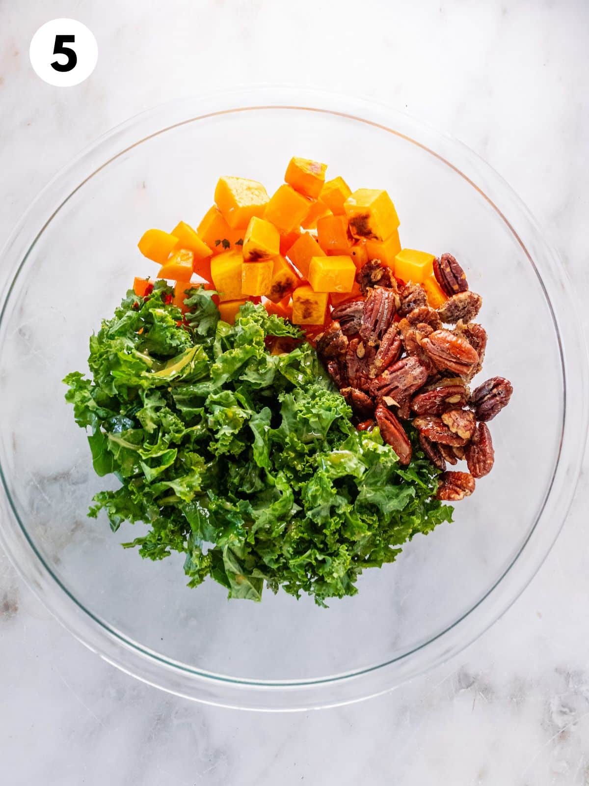 All the ingredients for the salad together in a glass bowl.