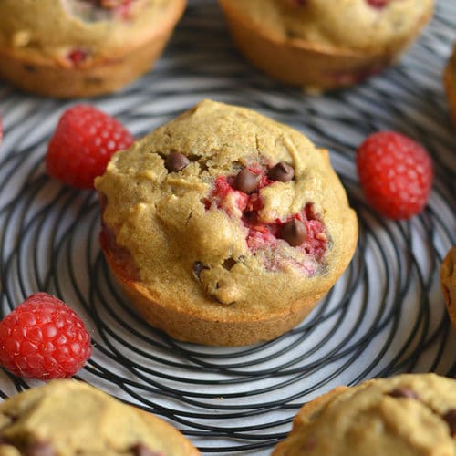 These Skinny Raspberry Chocolate Chip Muffins are easy to make for a healthy breakfast or snack! A gluten free and low calorie muffin recipe made from real food ingredients. With bursts of sweet raspberry and chocolate in every bite, this muffin is so delicious you won't believe it's good for you. Gluten Free + Low Calorie