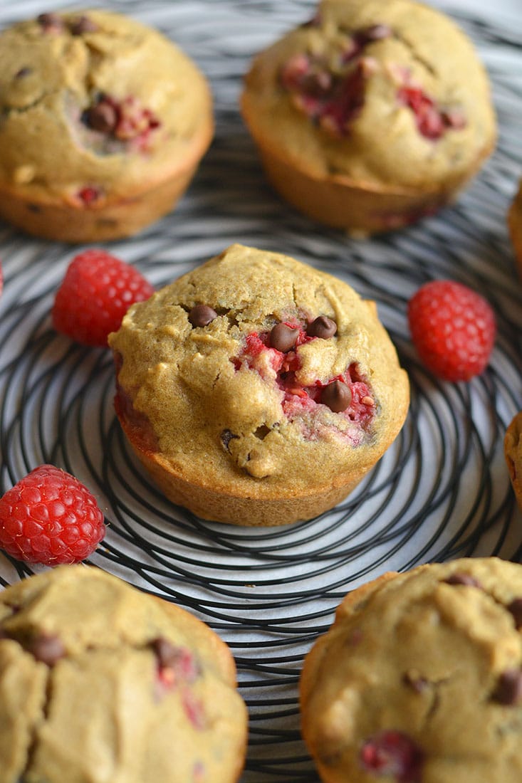 These Skinny Raspberry Chocolate Chip Muffins are easy to make for a healthy breakfast or snack! A gluten free and low calorie muffin recipe made from real food ingredients. With bursts of sweet raspberry and chocolate in every bite, this muffin is so delicious you won't believe it's good for you. Gluten Free + Low Calorie