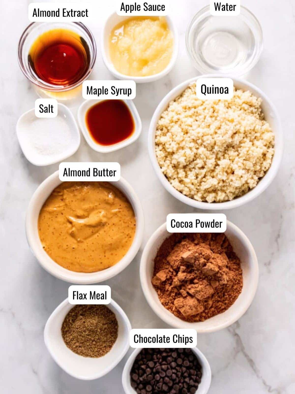 Bowls with quinoa brownie ingredients measured out before preparing. 