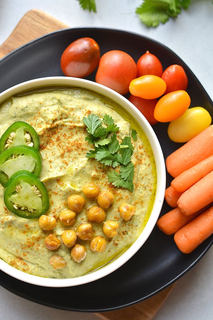 Spicy Cilantro Jalapeño Hummus! Made with fresh ingredients and a kick of spice. This homemade hummus is sure to brighten your plate! Perfect for dipping or using as a marinade. Gluten Free + Vegan + Gluten Free