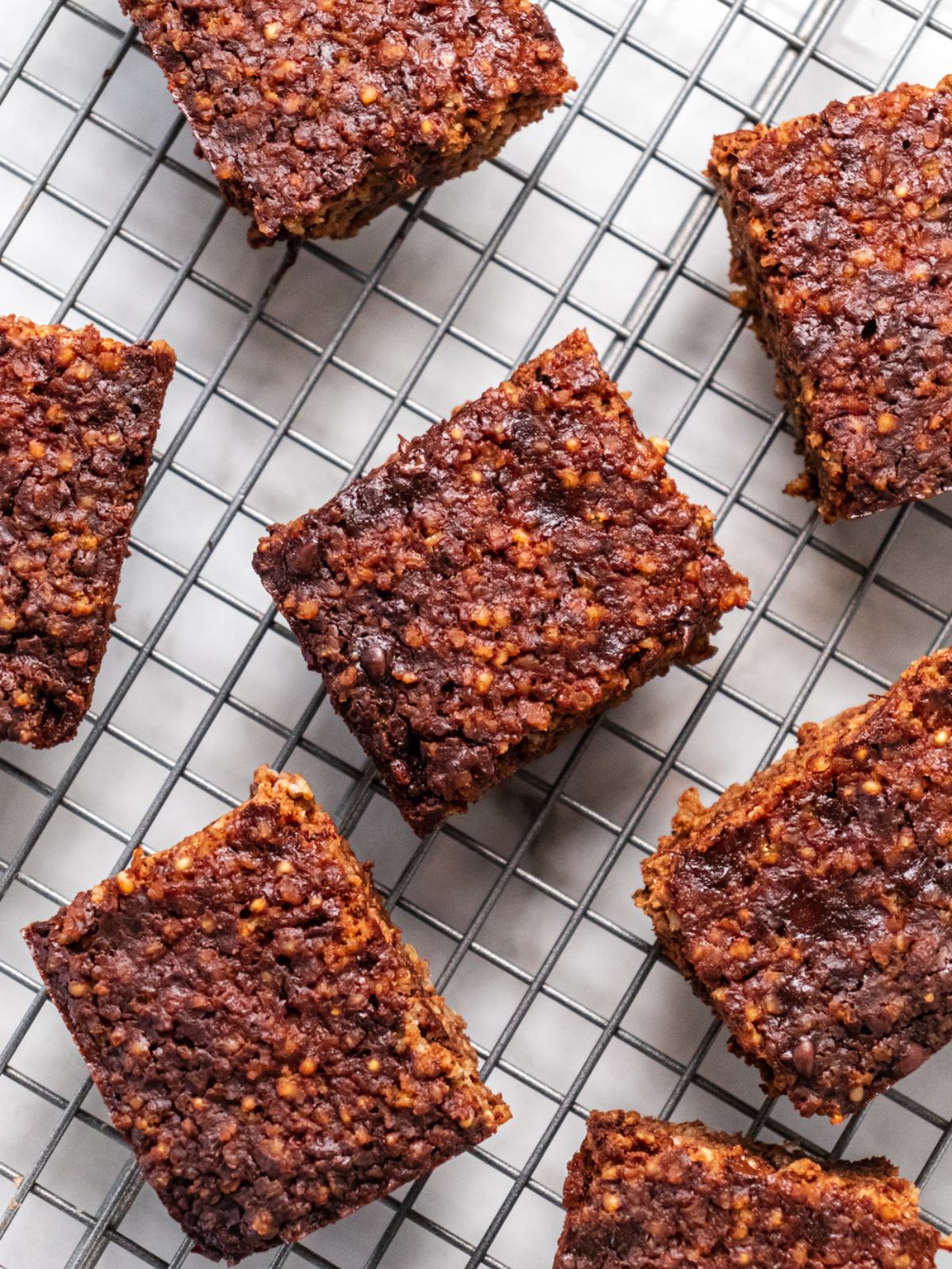 Quinoa brownies sliced on a wire baking rack.