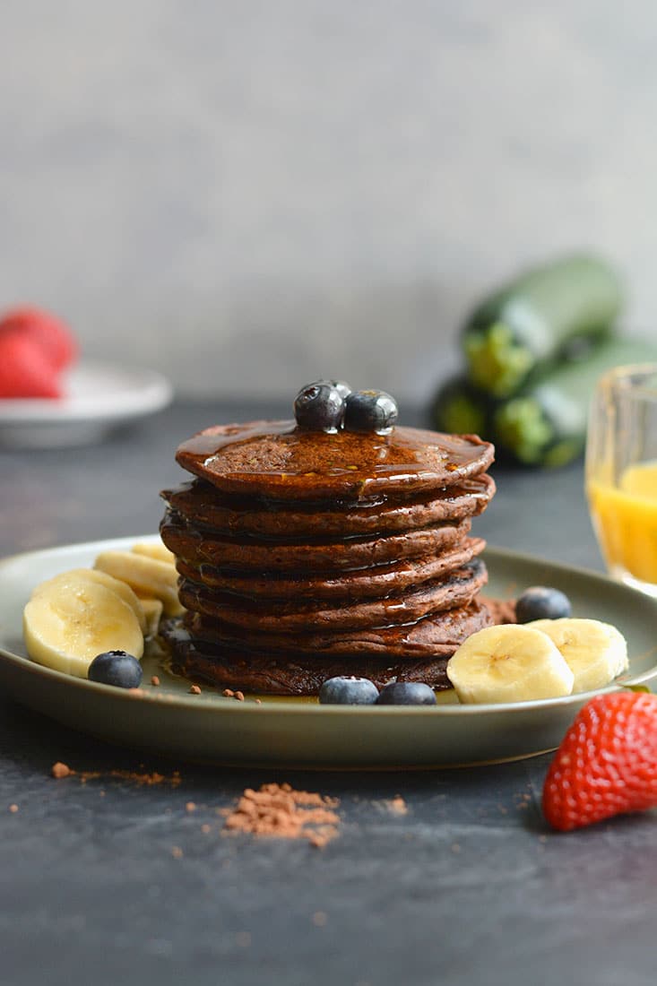 Zucchini Cocoa Pancakes are vegan, gluten free friendly and low in calories! Made with simple wholesome, real food ingredients and oh so tasty! These pancakes are a sneaky way to add more healthy foods to your diet in a chocolaty way. Vegan + Gluten Free + Low Calorie