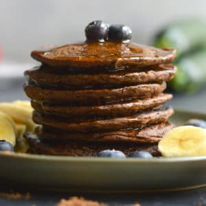 Zucchini Cocoa Pancakes are vegan, gluten free friendly and low in calories! Made with simple wholesome, real food ingredients and oh so tasty! These pancakes are a sneaky way to add more healthy foods to your diet in a chocolaty way. Vegan + Gluten Free + Low Calorie