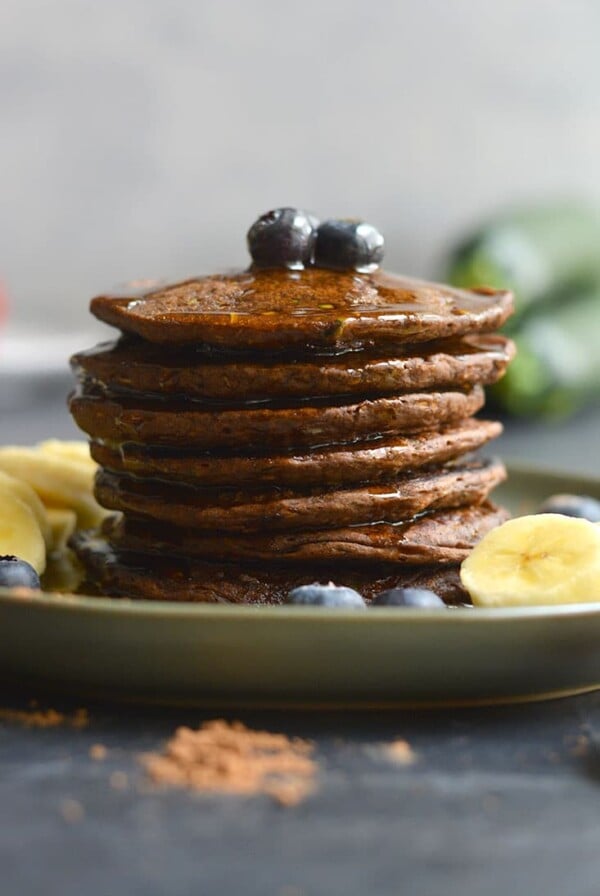 Zucchini Cocoa Pancakes are vegan, gluten free friendly and low in calories! Made with simple wholesome, real food ingredients and oh so tasty! These pancakes are a sneaky way to add more healthy foods to your diet in a chocolaty way. Vegan + Gluten Free + Low Calorie