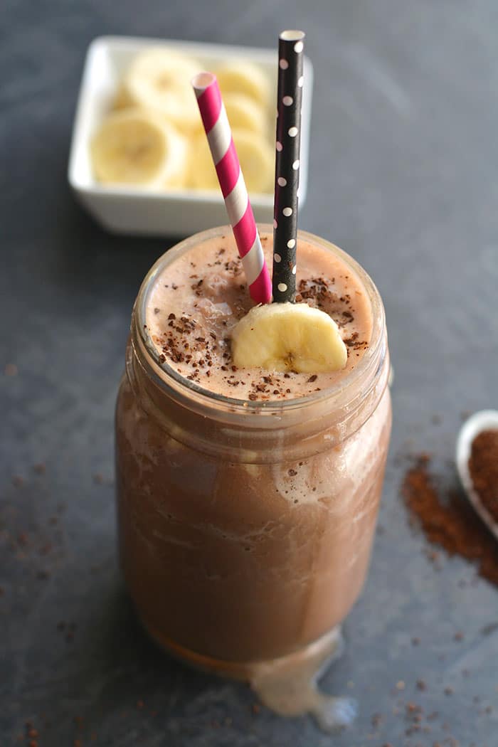 Chocolate Mocha Fudge Protein Smoothie! Get your caffeine fix with a plant based smoothie. Made with just 4 ingredients this smoothie is perfect for post workout recovery or a quick energy boost. Gluten Free + Low Calorie + Vegan + Paleo