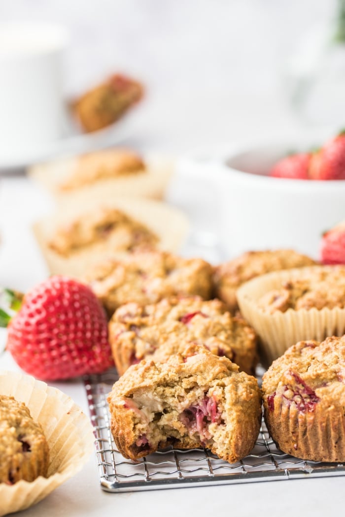 Strawberry Greek Yogurt Muffins! Bursting with strawberries and creamy greek yogurt, these easy to make muffins make a delicious low calorie breakfast or snack for just 84 calories. Quick to make and gluten free too! 