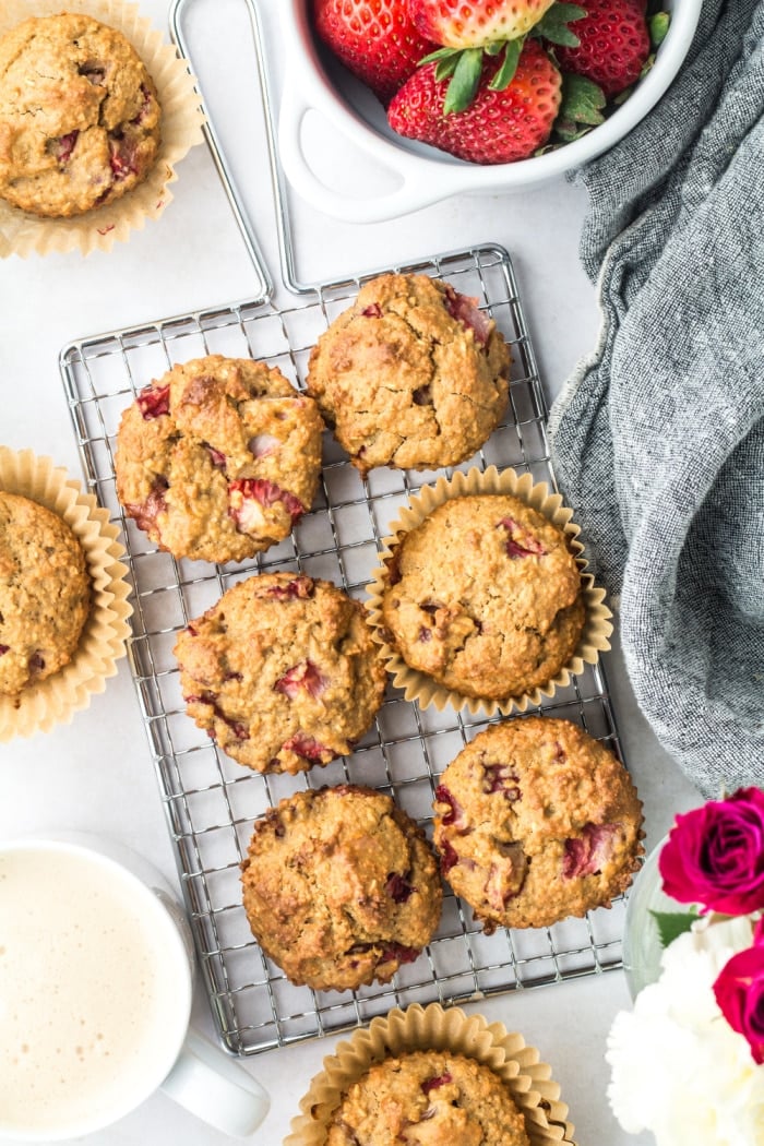 Strawberry Greek Yogurt Muffins! Bursting with strawberries and creamy greek yogurt, these easy to make muffins make a delicious low calorie breakfast or snack for just 84 calories. Quick to make and gluten free too! 