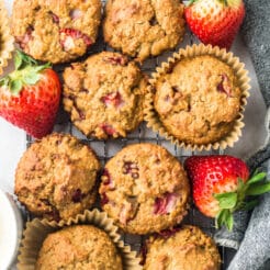 Strawberry Greek Yogurt Muffins! Bursting with strawberries and creamy greek yogurt, these easy to make muffins make a delicious low calorie breakfast or snack for just 84 calories. Quick to make and gluten free too!