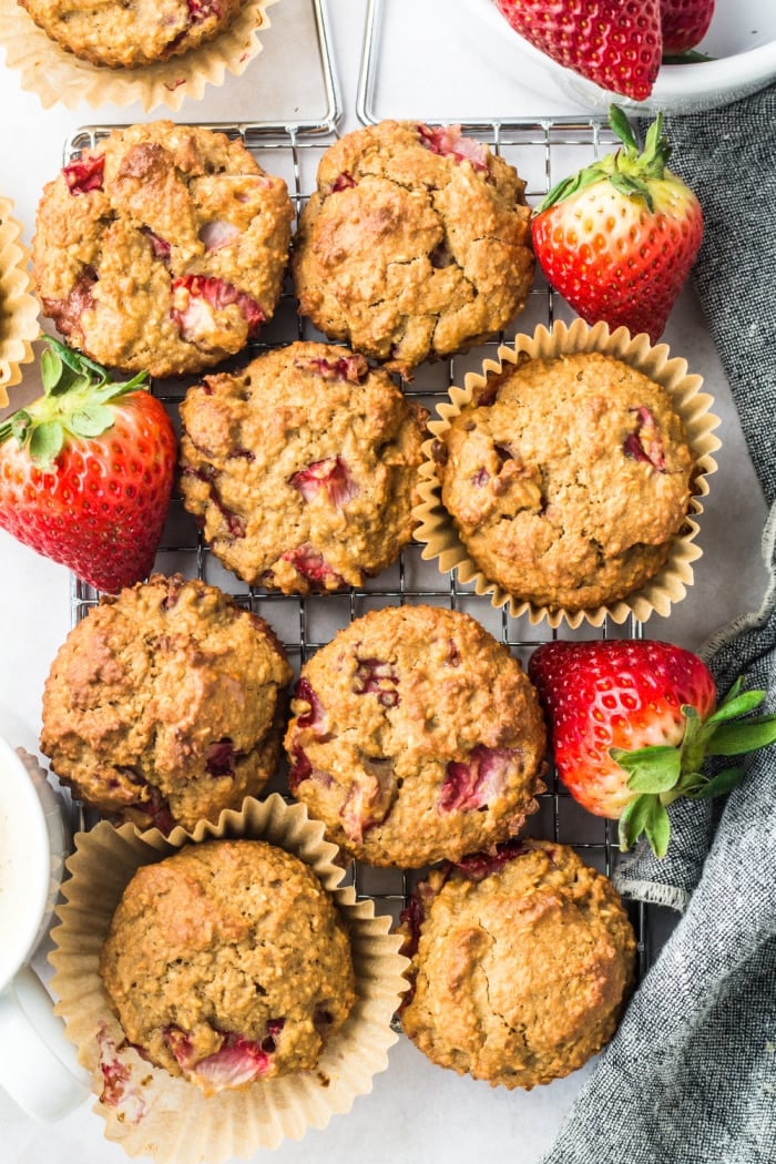 Strawberry Greek Yogurt Muffins! Bursting with strawberries and creamy greek yogurt, these easy to make muffins make a delicious low calorie breakfast or snack for just 84 calories. Quick to make and gluten free too! 