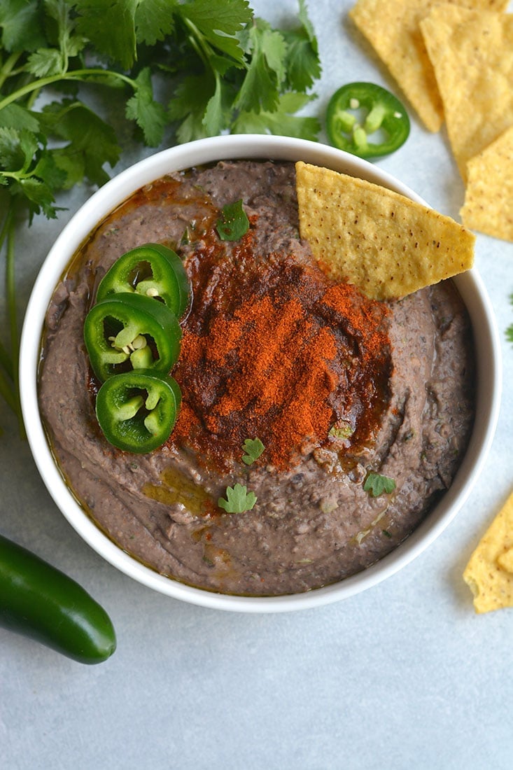 Spicy Black Bean Hummus Without Tahini lightened up by omitting the traditional ingredient without sacrificing taste. Pair with veggies & crackers for a healthy snack or spread on sandwich for extra protein & spice! Gluten Free + Vegan + Low Calorie