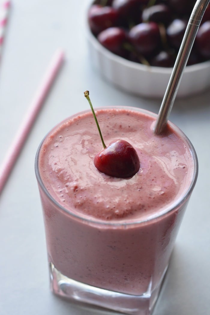 Skinny Greek Yogurt Cherry Smoothie! This high protein smoothie with Greek yogurt and sweetened with stevia is lightened up. Great for breakfast on the go or a post workout recovery snack! Gluten Free + Low Calorie