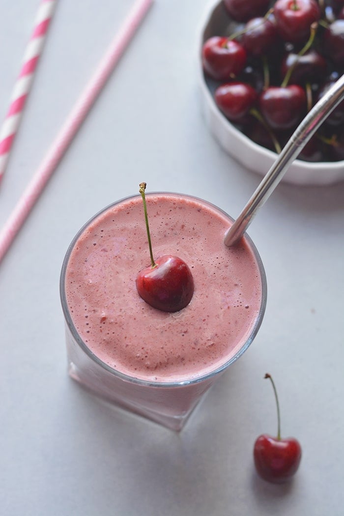 Skinny Greek Yogurt Cherry Smoothie! This high protein smoothie with Greek yogurt and sweetened with stevia is lightened up. Great for breakfast on the go or a post workout recovery snack! Gluten Free + Low Calorie