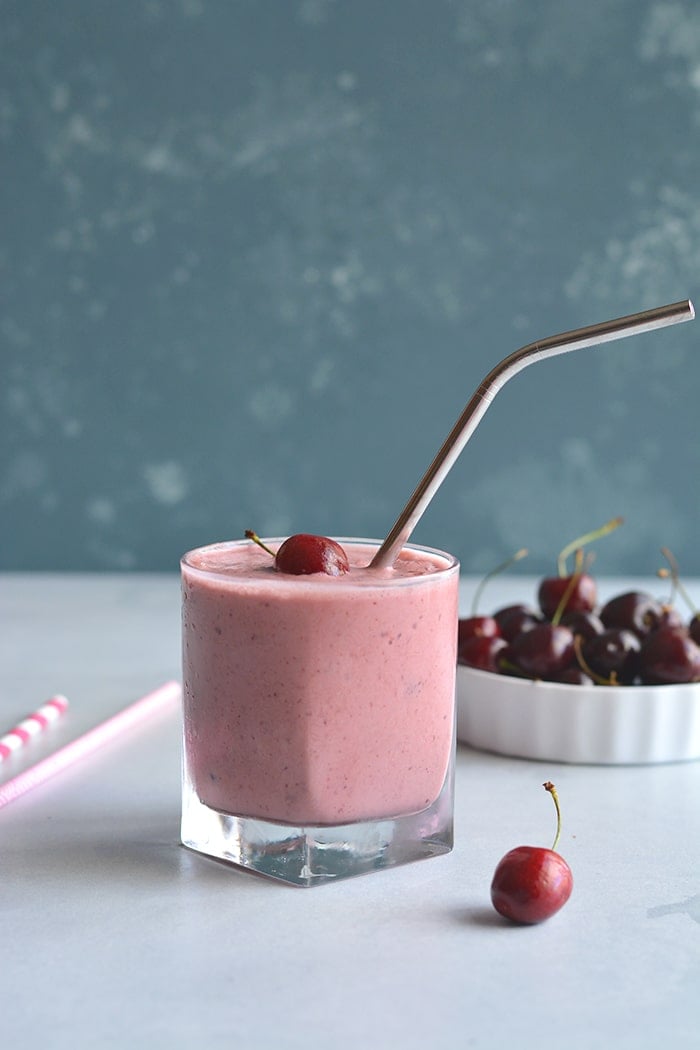 Skinny Greek Yogurt Cherry Smoothie! This high protein smoothie with Greek yogurt and sweetened with stevia is lightened up. Great for breakfast on the go or a post workout recovery snack! Gluten Free + Low Calorie