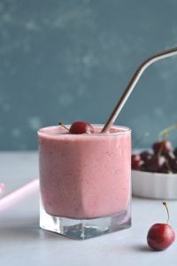 Skinny Greek Yogurt Cherry Smoothie! This high protein smoothie with Greek yogurt and sweetened with stevia is lightened up. Great for breakfast on the go or a post workout recovery snack! Gluten Free + Low Calorie