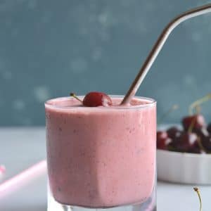 Skinny Greek Yogurt Cherry Smoothie! This high protein smoothie with Greek yogurt and sweetened with stevia is lightened up. Great for breakfast on the go or a post workout recovery snack! Gluten Free + Low Calorie