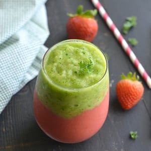 Vegan Kale Strawberry Pineapple Smoothie! A layered smoothie made banana free, dairy free and naturally sweetened with stevia and applesauce. Almost too pretty to eat! Gluten Free + Low Calorie + Vegan