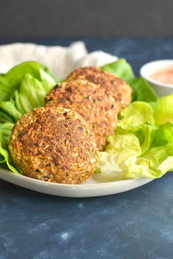 Zucchini Salsa Turkey Burgers! A fusion of salsa and zucchini flavors packed into a grilled turkey burger. Topped with a 2-ingredient salsa Greek yogurt dressing to make a flavorful veggie packed burgers that's unbelievably good. Gluten Free + Low Calorie