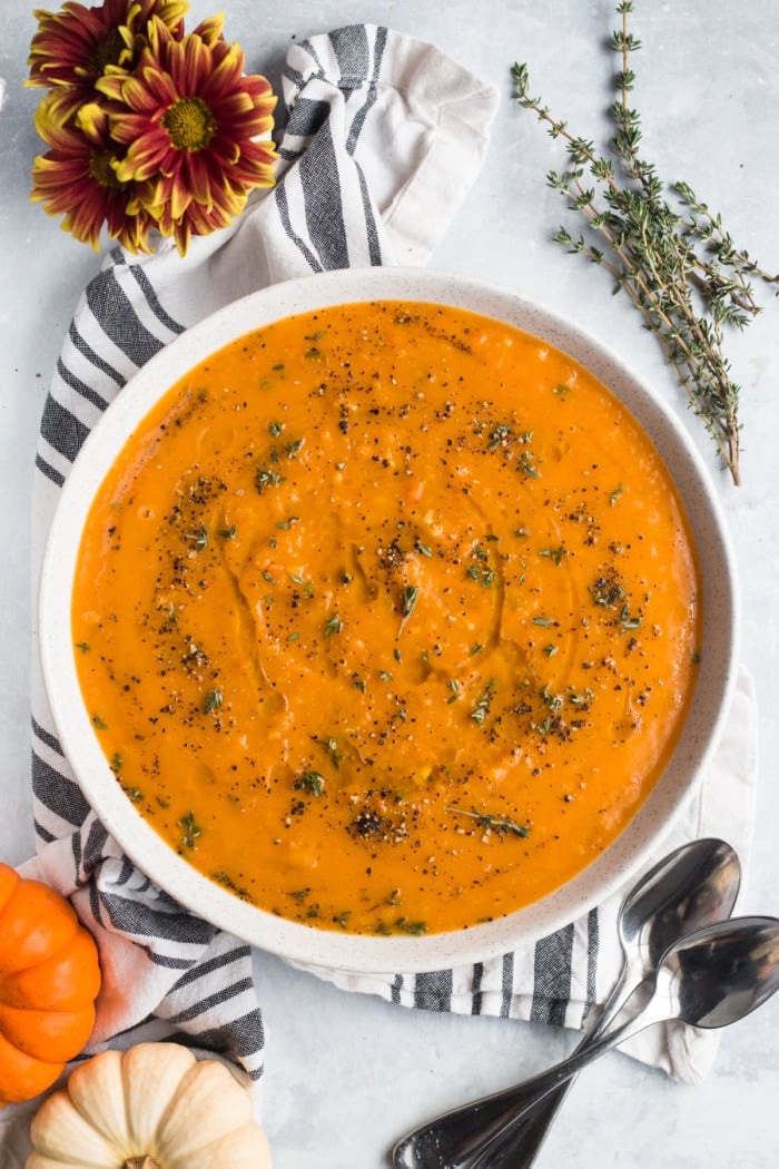 Butternut Sweet Potato Soup is a comforting, veggie packed soup. A butternut squash soup made low calorie, gluten free, Paleo and Vegan! A healthy and delicious bowl of veggie packed goodness!