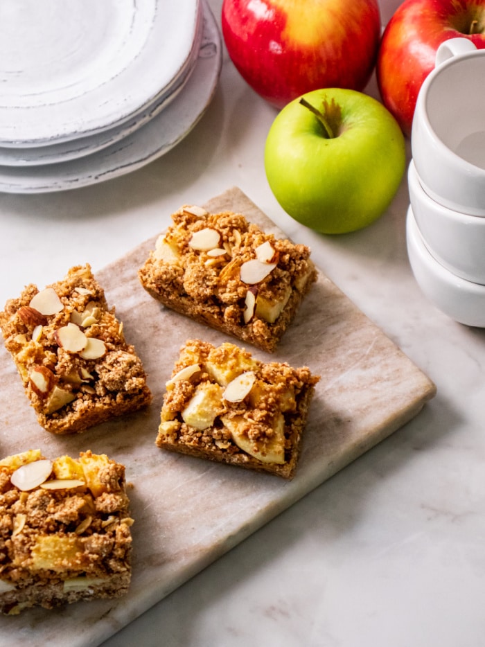 Healthy Apple Cinnamon Crumb Bars are a tasty fall treat made gluten free, dairy free and low calorie! They taste like a slice of apple pie in a bar.