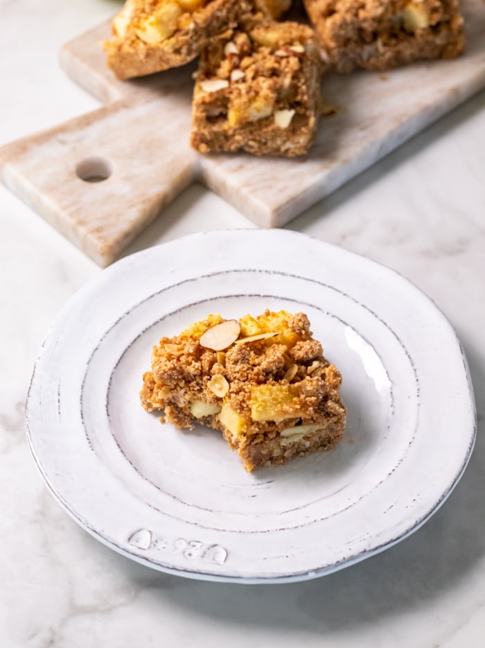 Healthy Apple Cinnamon Crumb Bars are a tasty fall treat made gluten free, dairy free and low calorie! They taste like a slice of apple pie in a bar.