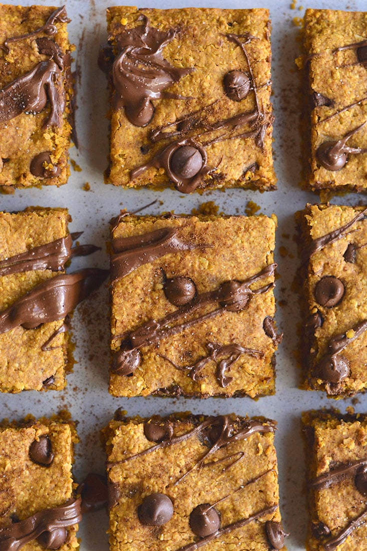 Pumpkin Chocolate Chip Cookie Bars are made with healthier baking ingredients for a better for you baked treat! Gluten free, lower in sugar and absolutely delicious! Vegan + Low Calorie + Gluten Free