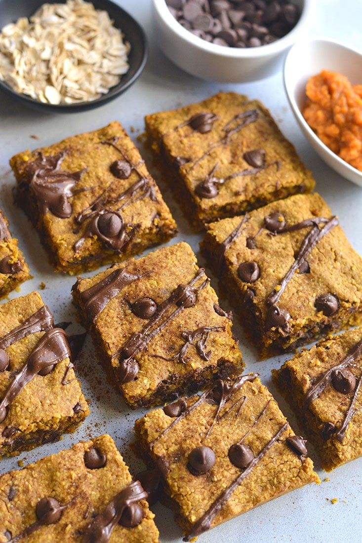 Pumpkin Chocolate Chip Cookie Bars are made with healthier baking ingredients for a better for you baked treat! Gluten free, lower in sugar and absolutely delicious! Vegan + Low Calorie + Gluten Free