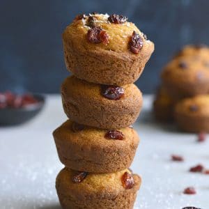 Delicious Coconut Cranberry Muffins made with Greek yogurt, coconut and oat flour are lightly sweetened. A healthier gluten free breakfast or snack on the go. Gluten Free + Low Calorie
