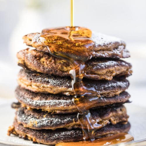 Pumpkin Coconut Pancakes made with coconut flour, nut butter, pumpkin and bananas! These thick, cake-like pancakes are perfect for a hearty fall breakfast. The BEST coconut flour pumpkin pancakes ever!