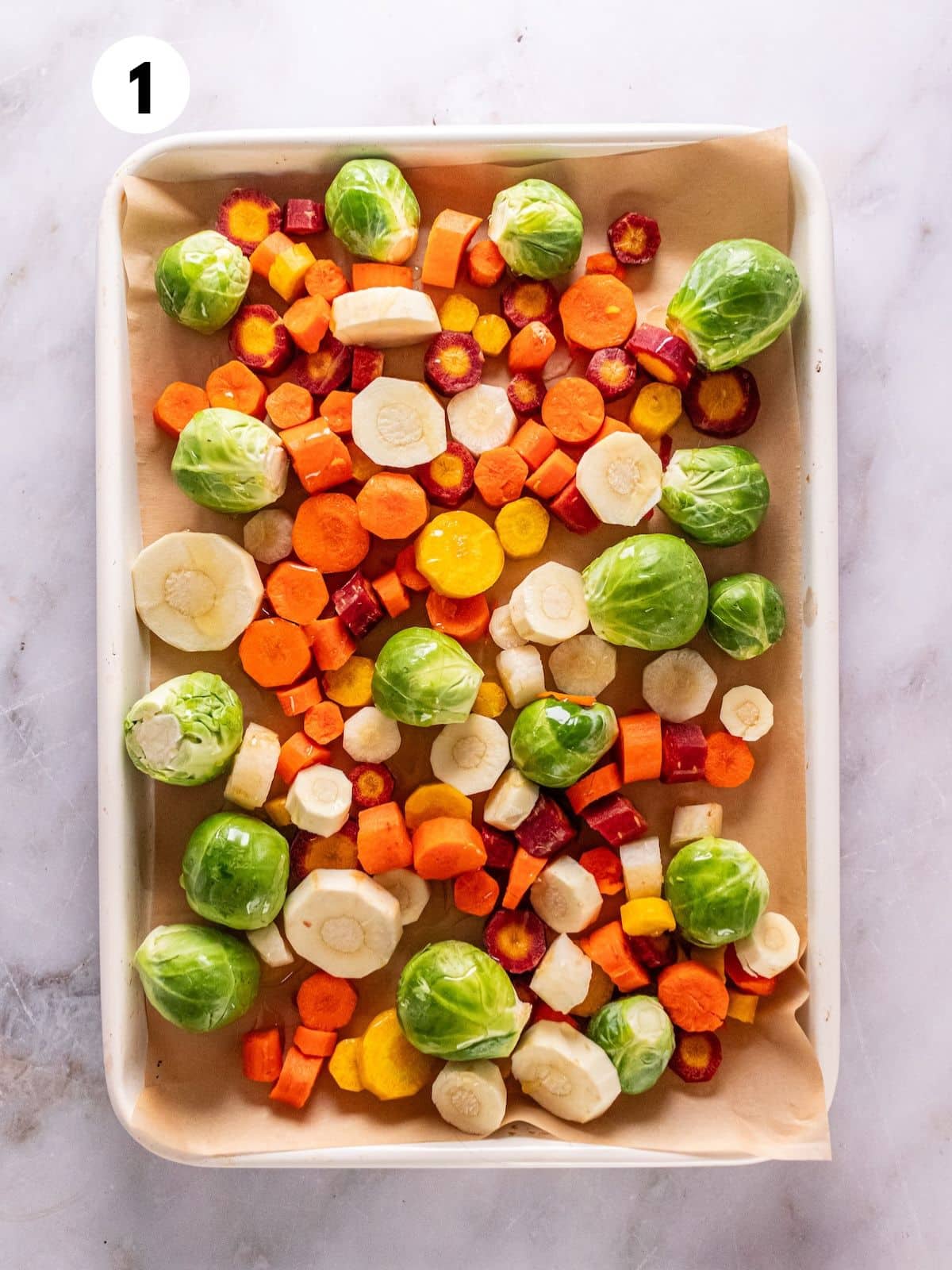 Roasted winter vegetables on a baking sheet.