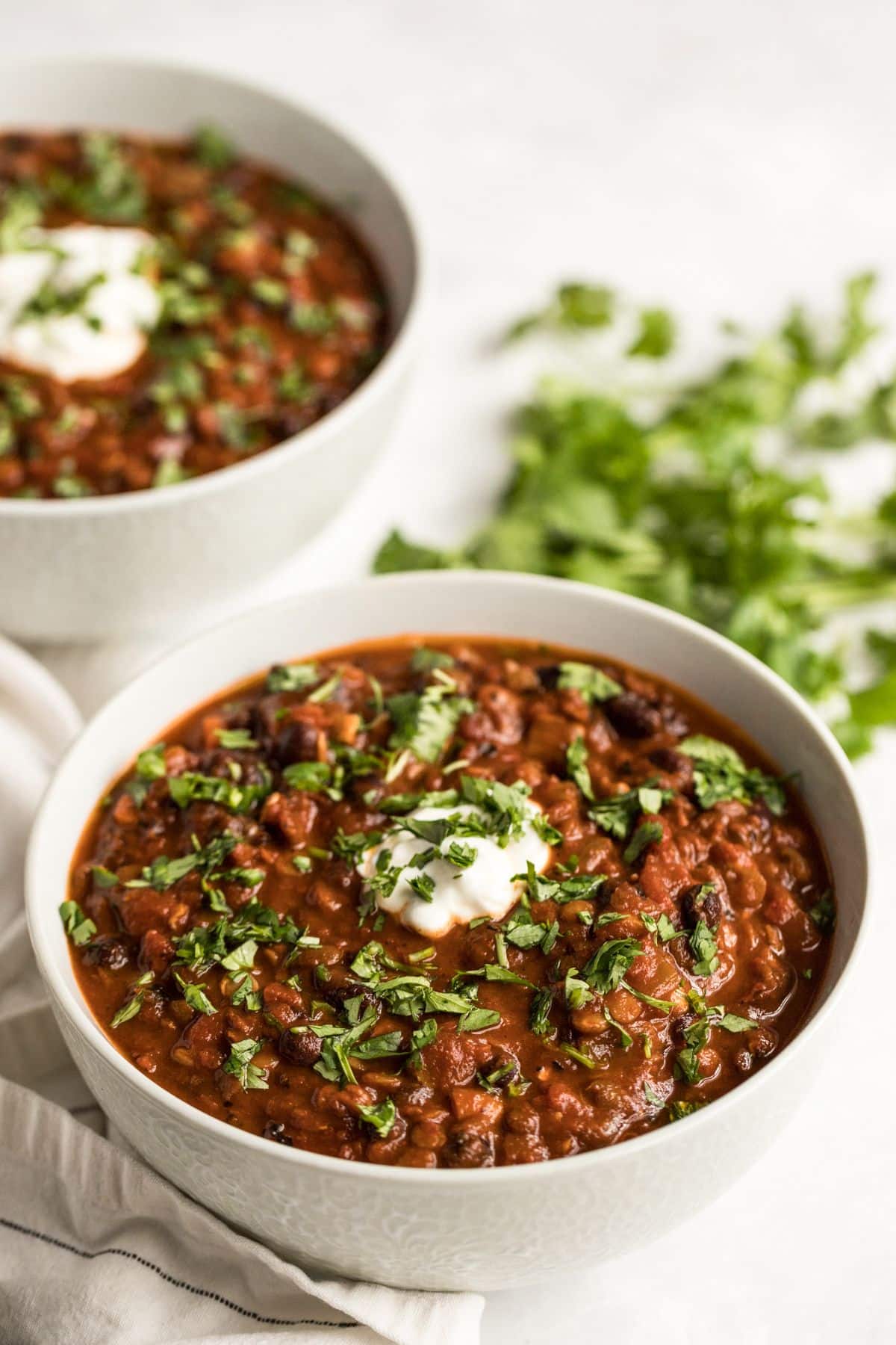 lentil chili in a white bowl.