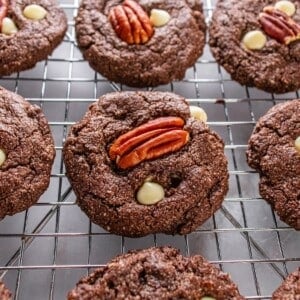 White chocolate pecan cookies on a cooling rack.