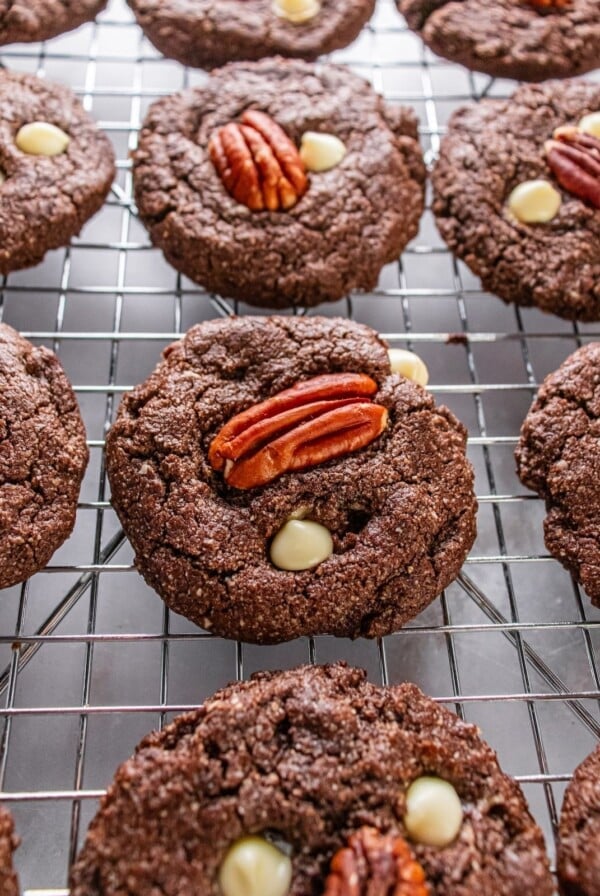 White chocolate pecan cookies on a cooling rack.