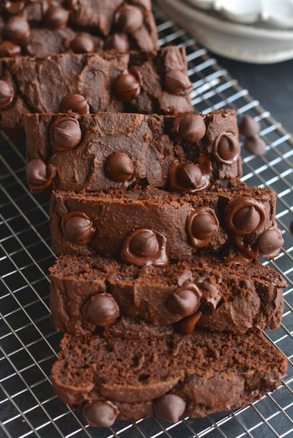Insanely delicious Dark Chocolate Butternut Squash Bread! Made gluten free with whole grains and lightly sweetened, this protein packed bread is a chocolate lover's dream. You won't even know it has butternut squash or is good for you! Gluten Free + Low Calorie