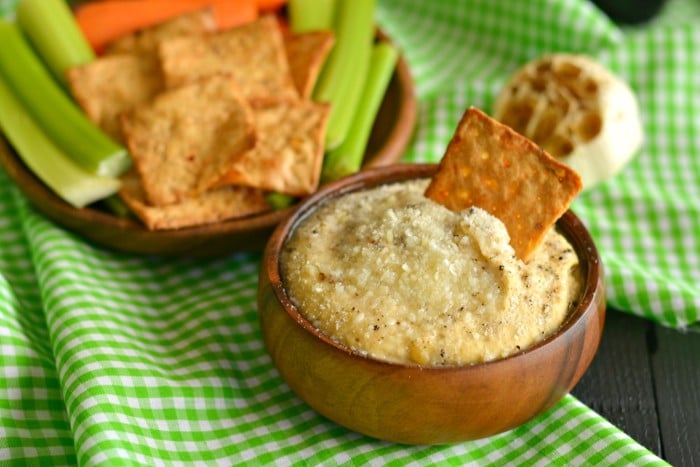 This roasted Garlic Parmesan Hummus is silky smooth, the creamiest hummus you will ever have! Layered with nutty flavors and loaded with garlic and pepper this dip has a flavorful kick. Your every day hummus jazzed up that will leave you begging for more!