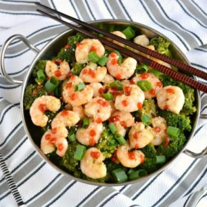 Shrimp & Broccoli Stir Fry is a quick, easy and healthy dinner you can make in under 20 minutes that's only 241 calories. A mouthwatering, one skillet meal great for a busy day! Gluten Free + Low Calorie