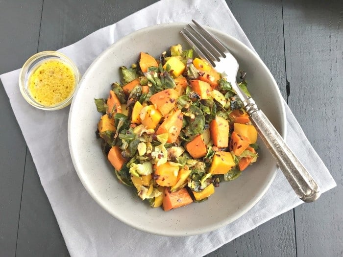 Brussels Sprouts Sweet Potato Salad is a warm and hearty salad. Made with roasted butternut squash, sweet potatoes and shredded brussels sprouts this nutrition packed salad is full of sweet and savory flavors!