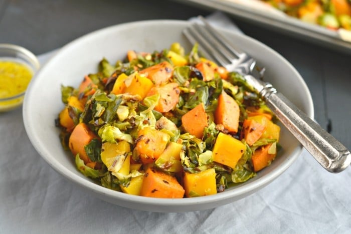 Brussels Sprouts Sweet Potato Salad is a warm and hearty salad. Made with roasted butternut squash, sweet potatoes and shredded brussels sprouts this nutrition packed salad is full of sweet and savory flavors!