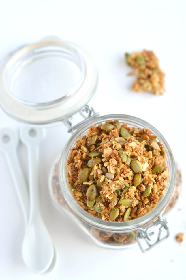 A super simple Paleo Granola made of almonds, seeds, shredded coconut and lathered in coconut oil and honey. A nutty and seedy snack that's irresistible and seriously addicting!