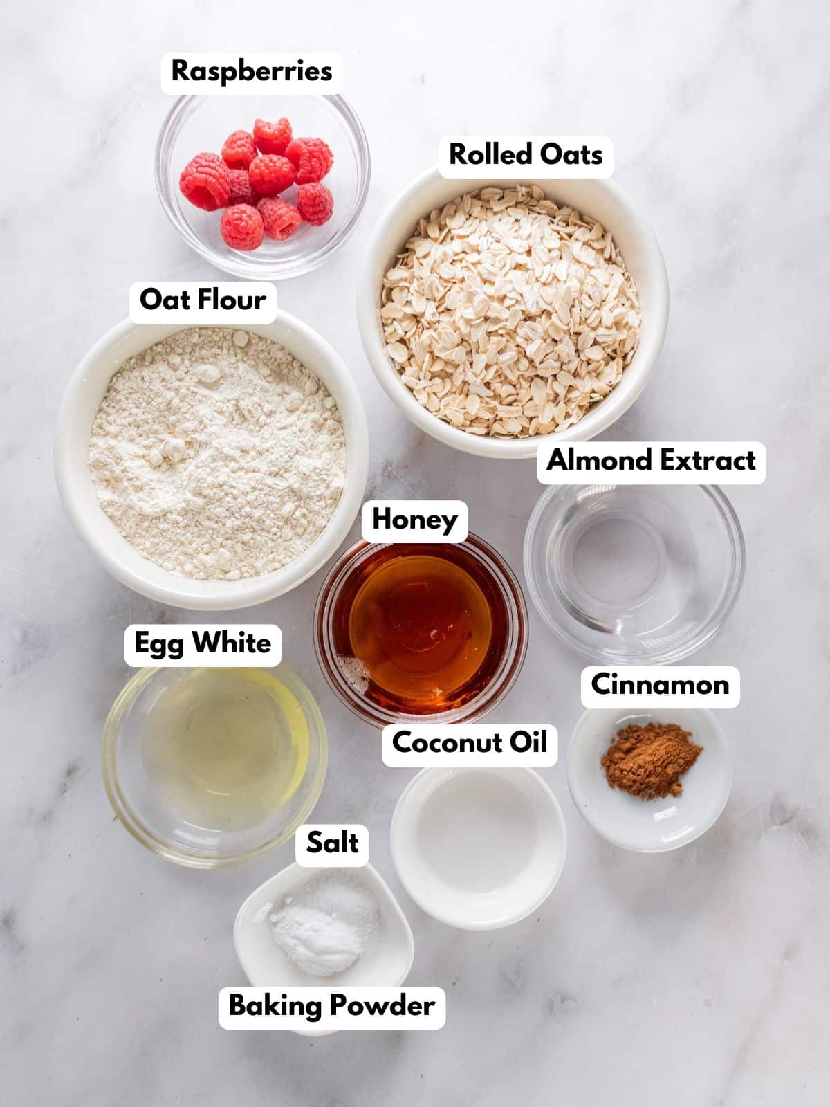 Ingredients to make these raspberry oatmeal cookies on a table.