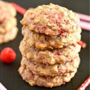 Raspberry oatmeal cookies stacked on top of one another.