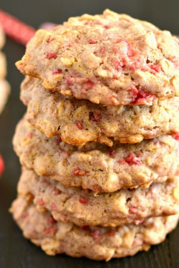 Raspberry oatmeal cookies stacked on top of one another.