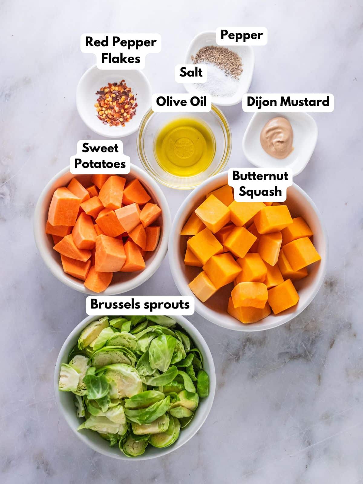 Ingredients to make roasted Brussels sprouts salad on a counter top.